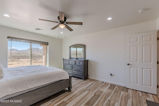 bedroom featuring visible vents, baseboards, light wood-style flooring, ceiling fan, and recessed lighting