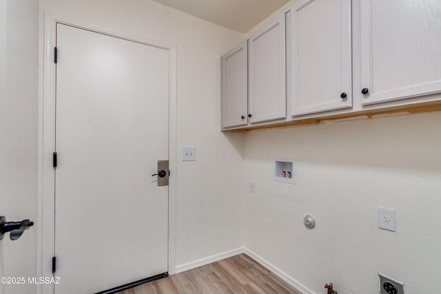 laundry area featuring gas dryer hookup, light wood-style flooring, hookup for a washing machine, cabinet space, and electric dryer hookup