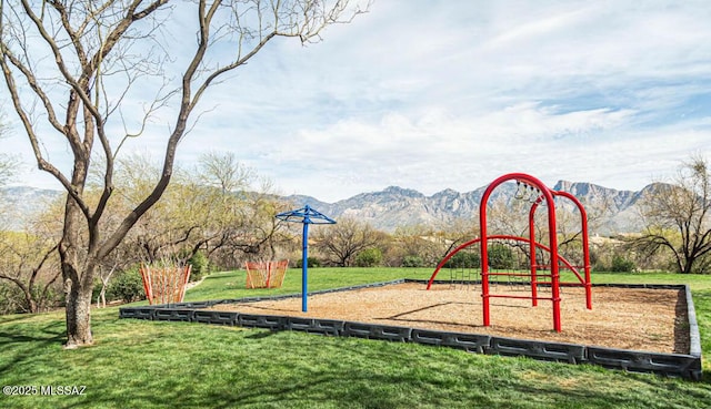 community play area featuring a yard and a mountain view