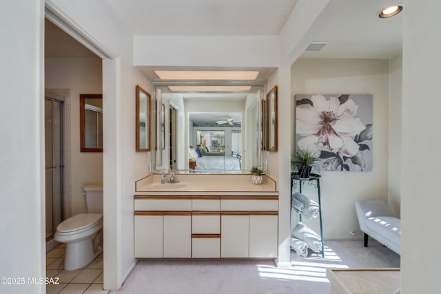 full bathroom with connected bathroom, toilet, tile patterned floors, an enclosed shower, and vanity