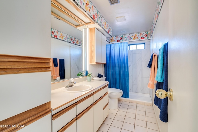 bathroom featuring visible vents, toilet, vanity, tile patterned flooring, and tiled shower