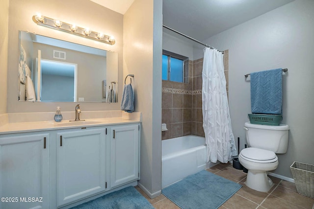 bathroom with visible vents, toilet, shower / bath combo with shower curtain, vanity, and tile patterned floors