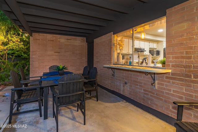 view of patio featuring outdoor dining space