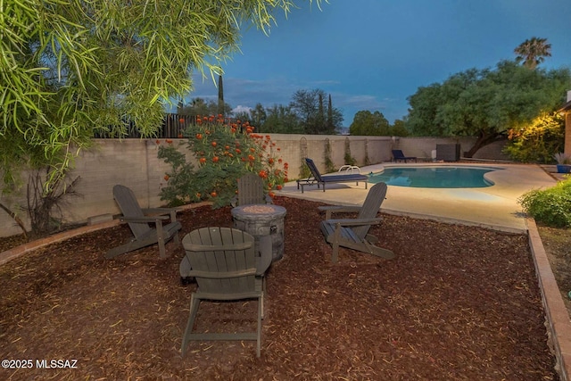 view of swimming pool with a fenced backyard, a fenced in pool, and a patio