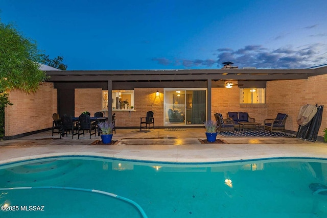 outdoor pool featuring a patio