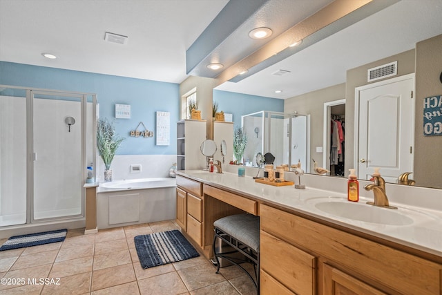 full bathroom with tile patterned flooring, visible vents, vanity, a shower stall, and a bath