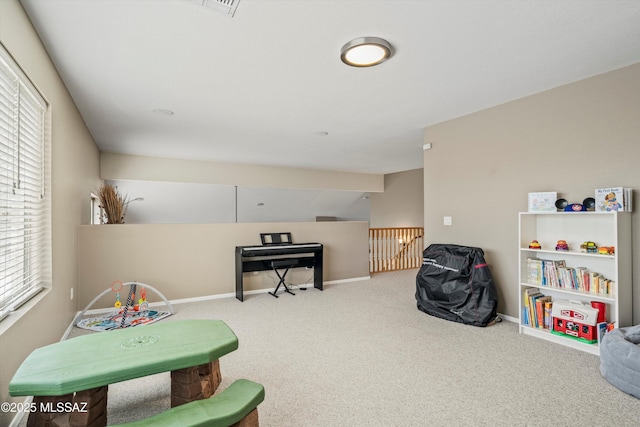 game room featuring carpet floors and baseboards