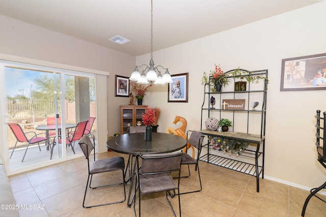 dining space featuring baseboards, visible vents, an inviting chandelier, and light tile patterned floors