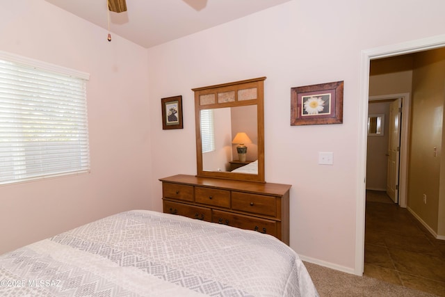 bedroom featuring ceiling fan, carpet, and baseboards