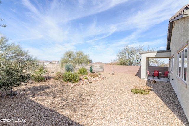 view of yard featuring a fenced backyard and a patio