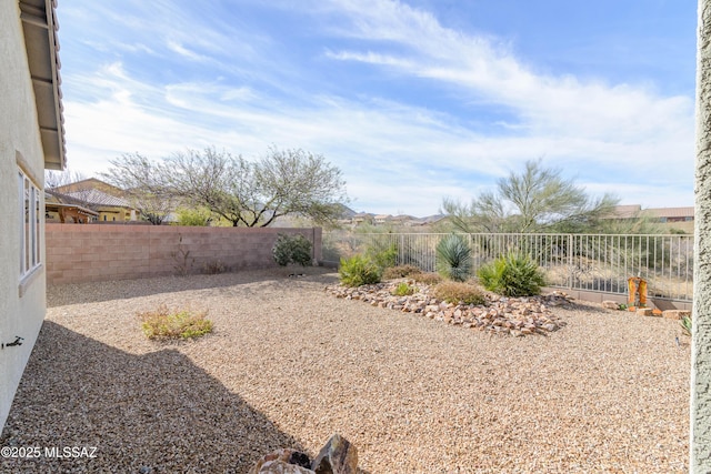 view of yard with a fenced backyard