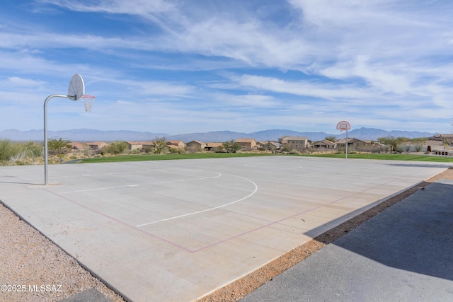 view of sport court with community basketball court and a mountain view