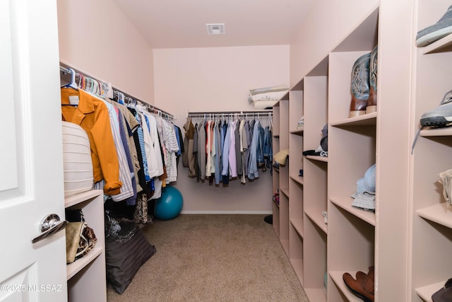 spacious closet with carpet floors and visible vents