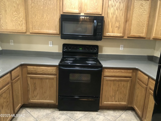 kitchen featuring black appliances and light tile patterned floors