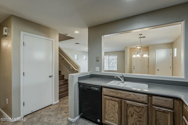 unfurnished bedroom with ensuite bath, dark wood finished floors, visible vents, and baseboards