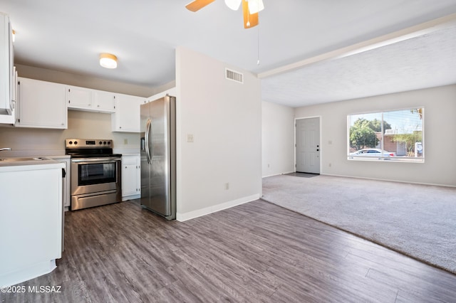 kitchen featuring visible vents, open floor plan, dark wood-type flooring, stainless steel appliances, and white cabinetry