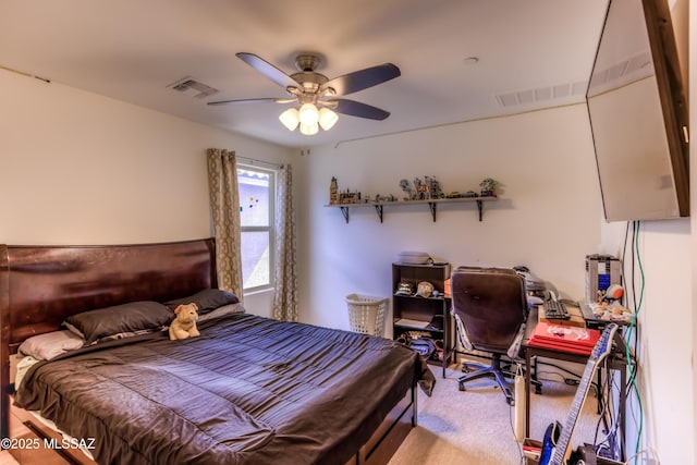 bedroom featuring visible vents, ceiling fan, and carpet flooring