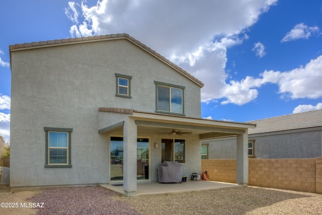 back of house featuring ceiling fan, a patio area, fence, and stucco siding