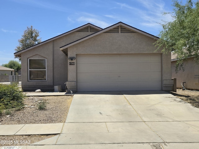 1702 E Saint Bernadine St, Tucson, AZ 85713 - ranch-style home featuring stucco siding, driveway, and a garage