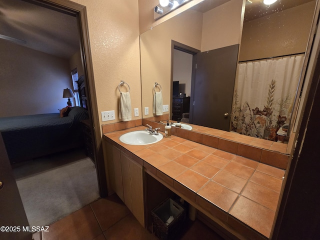 1702 E Saint Bernadine St, Tucson, AZ 85713 - full bathroom with ensuite bathroom, vanity, and tile patterned floors