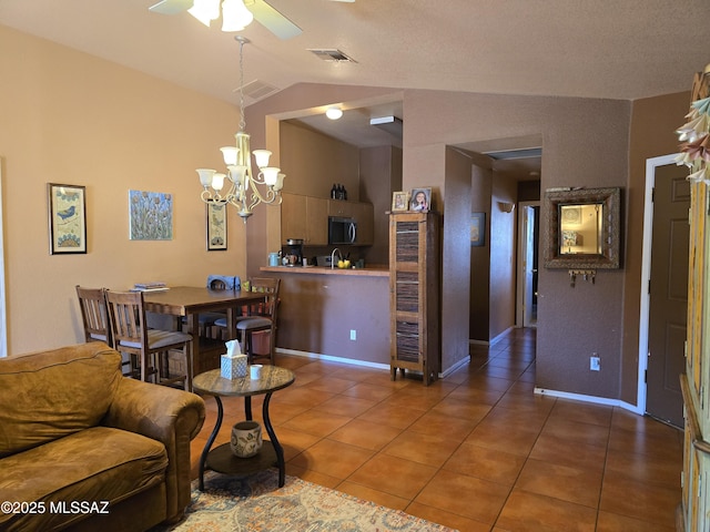 1702 E Saint Bernadine St, Tucson, AZ 85713 - living room with tile patterned floors, a chandelier, lofted ceiling, ceiling fan, and baseboards