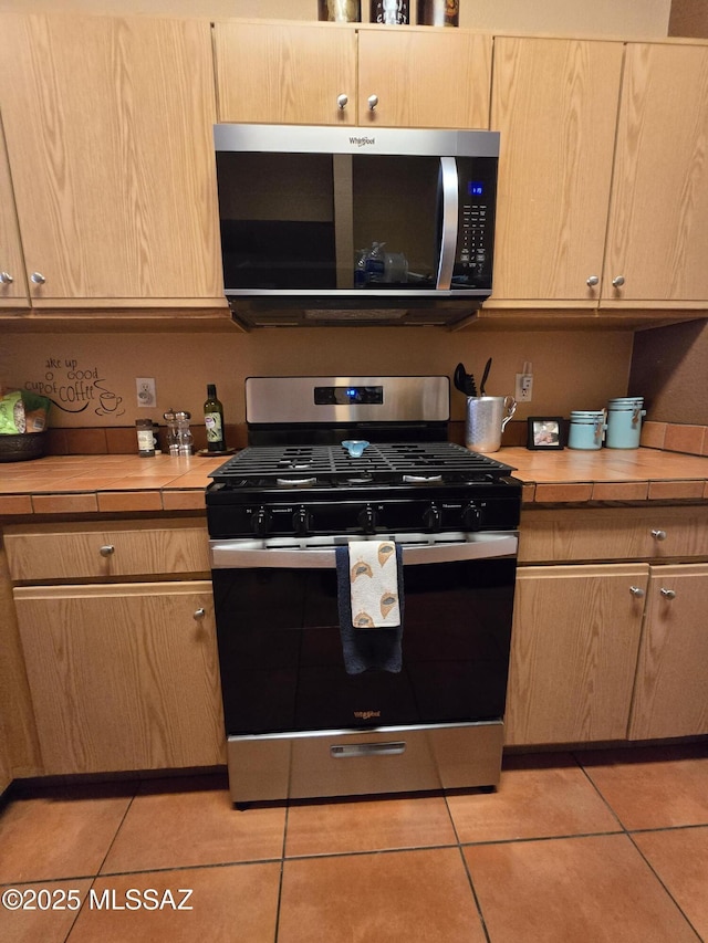 1702 E Saint Bernadine St, Tucson, AZ 85713 - kitchen featuring stainless steel appliances, light brown cabinets, and light tile patterned floors