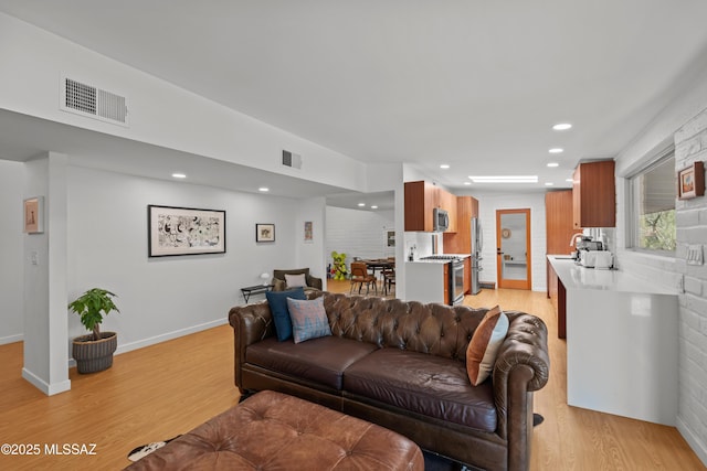 6530 N Camino De La Karina, Tucson, AZ 85718 - living area with light wood-style flooring, recessed lighting, and baseboards