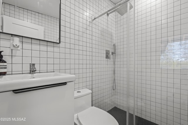 6530 N Camino De La Karina, Tucson, AZ 85718 - bathroom with tile walls, a shower stall, toilet, vanity, and backsplash