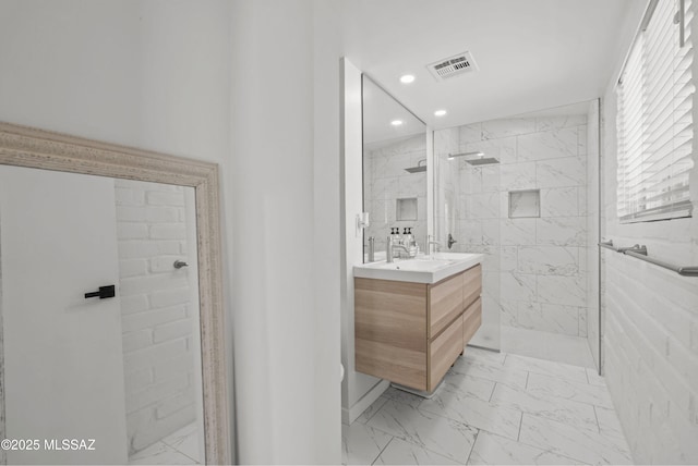 6530 N Camino De La Karina, Tucson, AZ 85718 - bathroom featuring marble look tiles, vanity, recessed lighting, and a marble finish shower