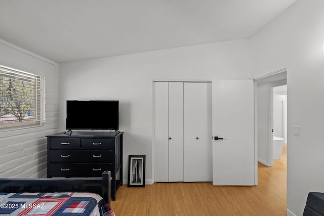 6530 N Camino De La Karina, Tucson, AZ 85718 - bedroom featuring light wood-style flooring and a closet