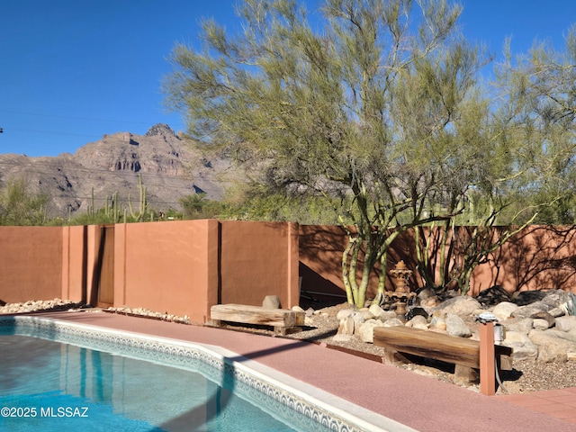 6530 N Camino De La Karina, Tucson, AZ 85718 - view of pool with fence and a mountain view