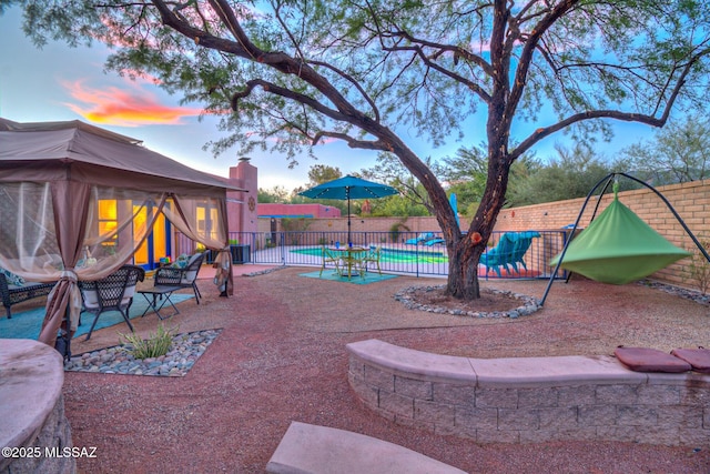 view of yard featuring a patio area, cooling unit, fence, and a playground