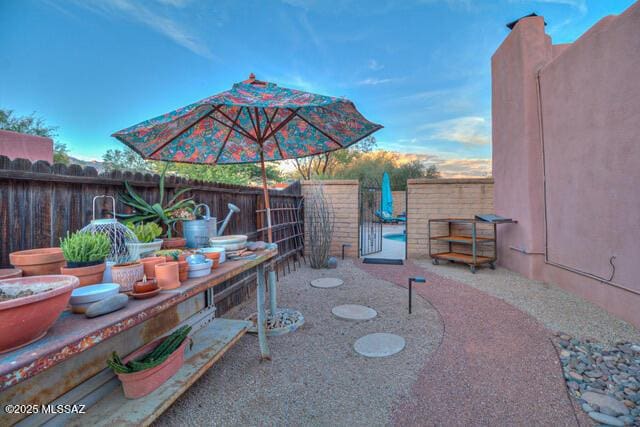 view of patio / terrace featuring fence