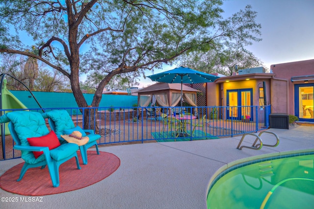 view of patio featuring fence