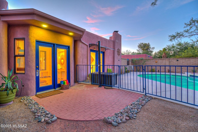 exterior space featuring a fenced in pool and a fenced backyard