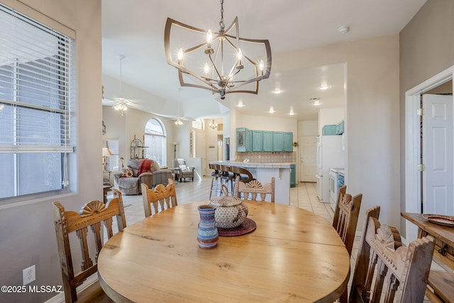 dining room featuring light tile patterned floors and a ceiling fan