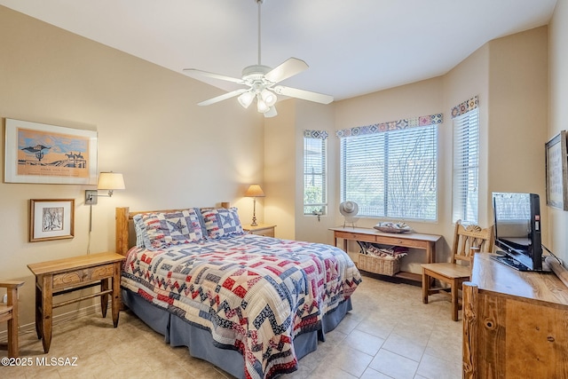 bedroom featuring a ceiling fan and tile patterned flooring