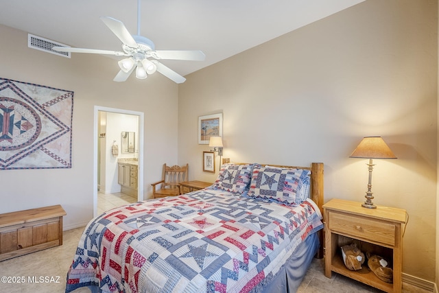 bedroom featuring ceiling fan, light tile patterned flooring, visible vents, and connected bathroom