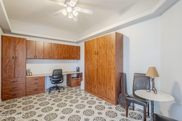 office space featuring light tile patterned floors, built in study area, and ceiling fan