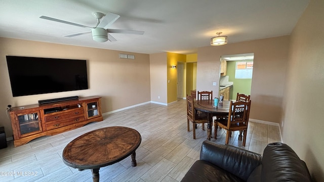 dining area featuring wood finish floors, visible vents, baseboards, and ceiling fan