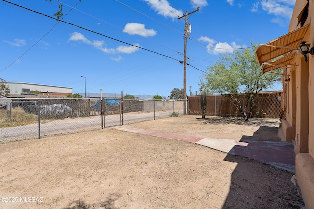 view of yard featuring a gate and fence