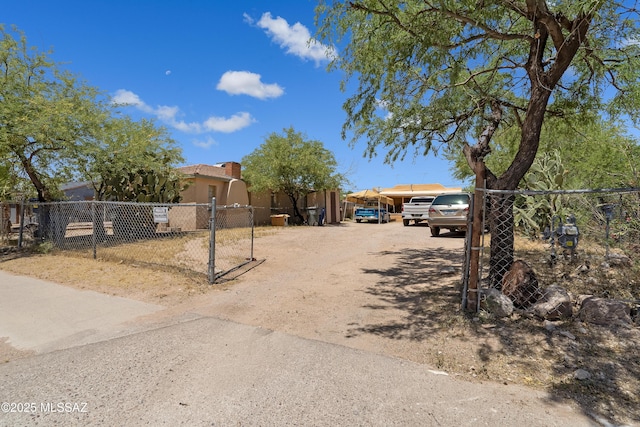 view of yard featuring driveway and a fenced front yard