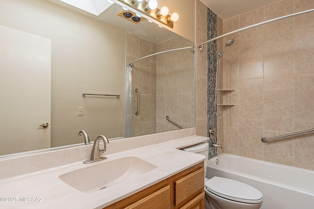 bathroom with washtub / shower combination, toilet, and vanity