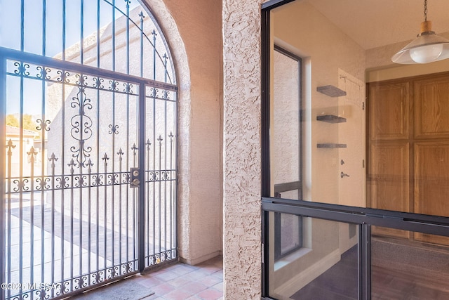 view of exterior entry with a gate