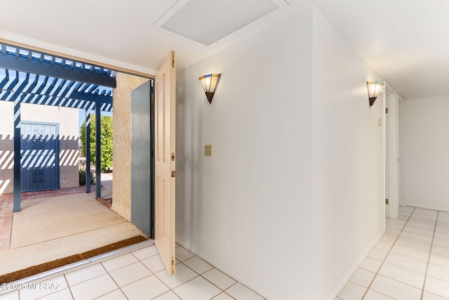 interior space with light tile patterned floors and visible vents