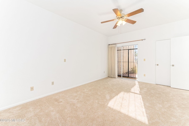 unfurnished bedroom with light colored carpet and baseboards