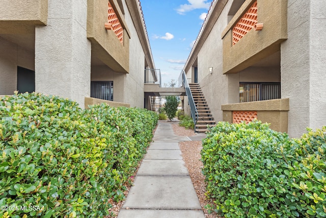 view of home's community featuring stairway