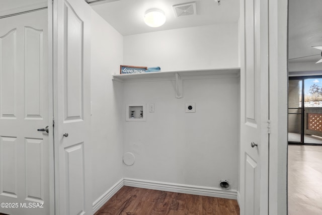 laundry room featuring electric dryer hookup, visible vents, wood finished floors, hookup for a washing machine, and laundry area