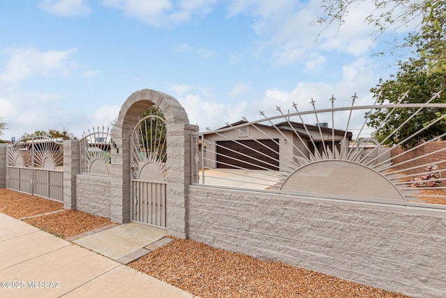 exterior space with a gate and a fenced front yard