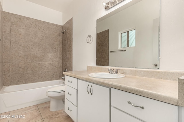 bathroom featuring vanity, toilet, tile patterned flooring, and shower / bath combination